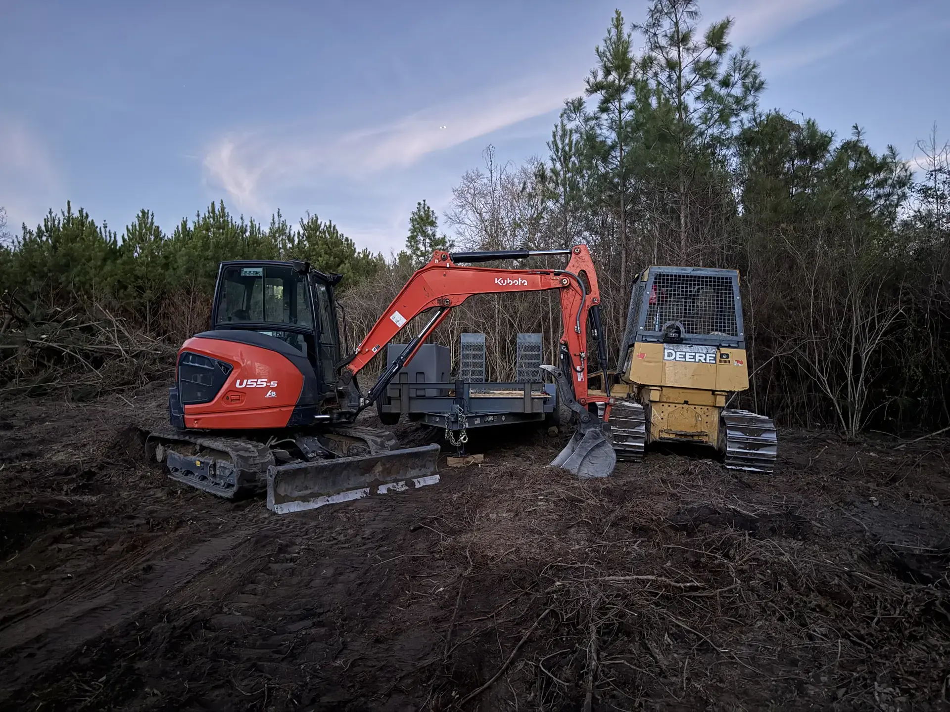 Excavator and dozer working a land clearing jobsite together
