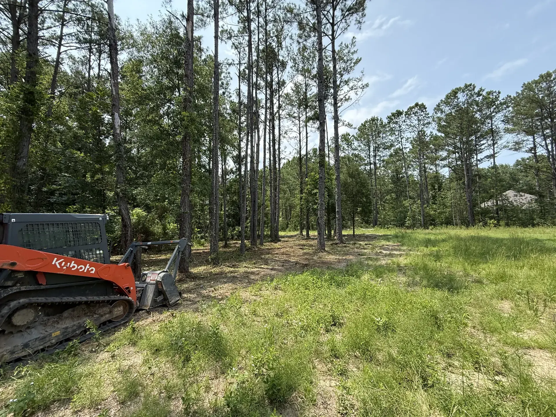 Tracked forestry mulcher grinding brush on an East Alabama jobsite