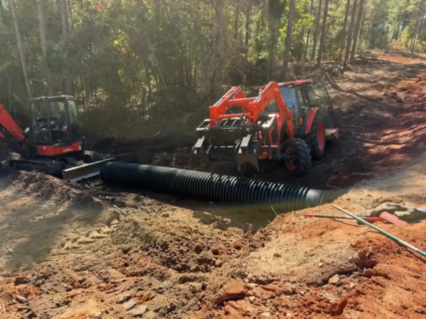 Large culvert pipe being installed to improve property drainage